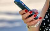 Woman-using-mobile-phone--whatsapp_172b42b0715_large