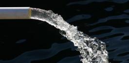 close-up-of-water-pipe-with-pouring-water-184935202