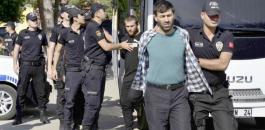 Turkish police officers escort men, suspected of being ISIS-ap