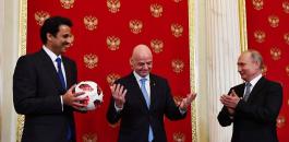 بوتين يسلم قطر شارة كأس العالم 