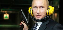 Russian-President-Vladimir-Putin-stands-with-a-gun-at-a-shooting-gallery