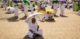 Muslim pilgrims use umbrellas to shade themselves from the sun as they arrive at the base of Mount Arafat, also known as Jabal al-Rahma or Mount of Mercy, during the annual hajj pilgrimage on June 15, 2024 Fadel SENNA _.jpg