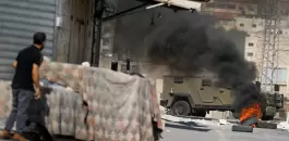 a-palestinian-man-looks-at-an-israeli-military-vehicle-during-an-israeli-raid-in-tubas-in-the-israeli-occupied-west-bank-october.webp