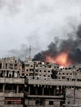 داعش يرفع الرايات البيضاء بمخيم اليرموك بعد قصف طائرات النظام السوري