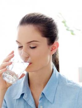 woman-drinking-glass-water-morning