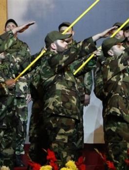 Tuesday, Feb. 16, 2010, Hezbollah members perform during a rally commemorating the 2008 assassination of Hezbollah\'s top military commander Imad Mughniyeh in Beirut\'s southern suburbs, Lebanon.