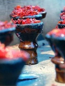 ضبط مصنع للسجائر والمعسل في  يعبد 