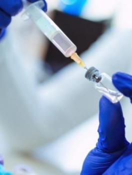 researcher-with-experimental-vaccine-660x330