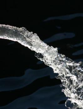close-up-of-water-pipe-with-pouring-water-184935202