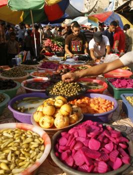 A-Palestinian-vendor-sells-pickles-on-the-third-day-of-the-Muslim-fasting-month-of-Ramadan