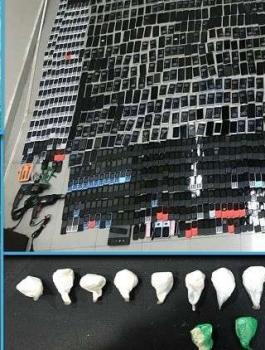 الشرطة الكويتية تضبط مئات الهواتف النقالة والحبوب المخدرة داخل سجن مركزي