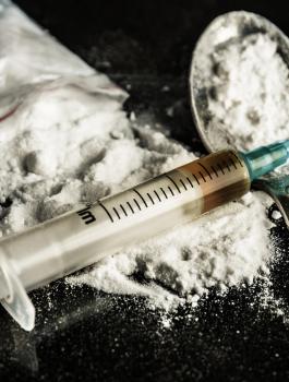 bigstock-Drug-Syringe-And-Cooked-Heroin-76081889