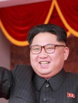 97531183_North_Korean_leader_Kim_Jong_Un_waves_from_Kim_Il_Sung_Square_before_the_start_of_a_mass_ra-large_trans++KkzUGe8q7_A35DWV6BPUcaXdHsmKH8yTHSUA0EWNyyI