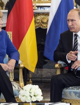 بوتين وميركل 