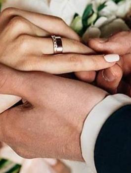 wedding-processional-songs-bride-and-groom-hands-rings-featured_446507_original