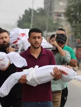 palestinian-men-carry-civilians-including-children-wrapped-in-white-cloths-killed-by-israeli-attacks-on-gaza.webp