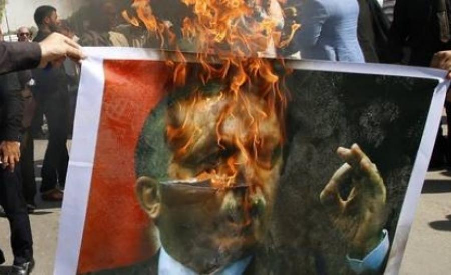 حرق صور اردوغان في ادلب 