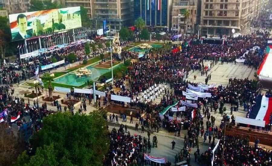 آلاف السوريون يحتفلون بالذكرى الأولى لاستعادة حلب ويرفعون لافتات:القدس عاصة أبدية لفلسطين