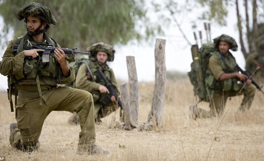 1406045616131_Image_galleryImage_Israeli_soldiers_kneel_du